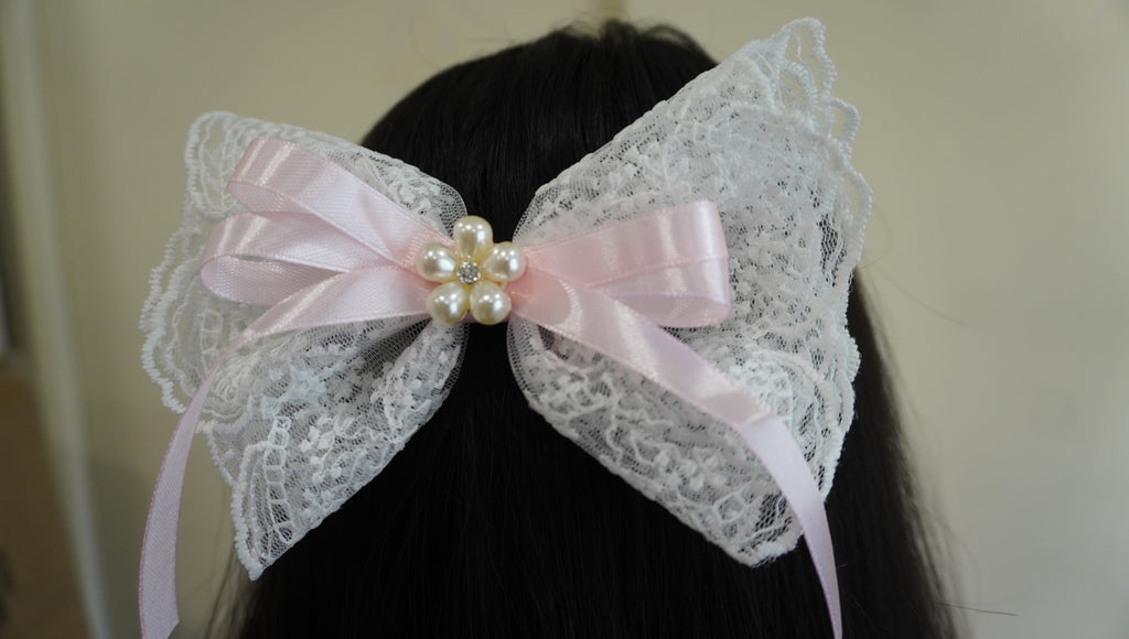 Elegant white and pink bow clip