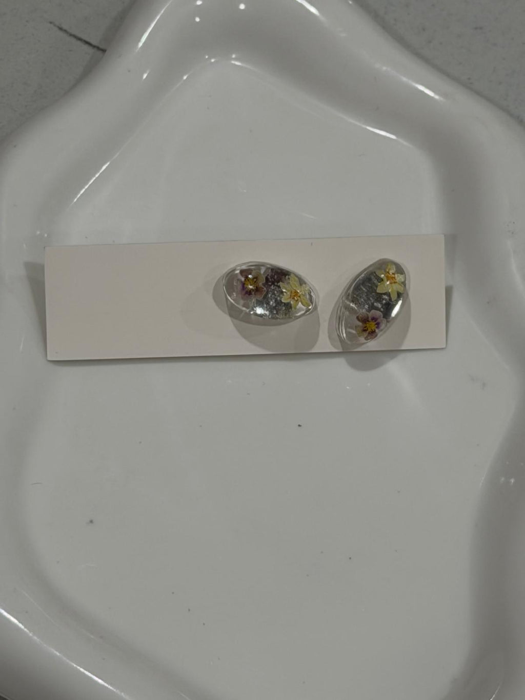 Resin ear tops